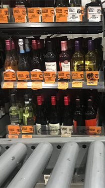 Wine bottles organized on metal shelving at Cornerstone Systems warehouse in Memphis